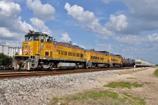 Union Pacific and BNSF have sent letters to Senator John Thune (R-SD) declaring that if the PTC mandate deadline is not extended, they will cease carrying any TIH or passenger traffic on affected lines effective January 1st, 2016.  Here a UP switch job handles tank cars in Laporte, Texas on the Houston Ship Channel in 2013.  Chemical manufacturers would be one segment of industry among many negatively affected by such an embargo. (Image (c) Nikki Burgess 9/2014; all rights reserved)