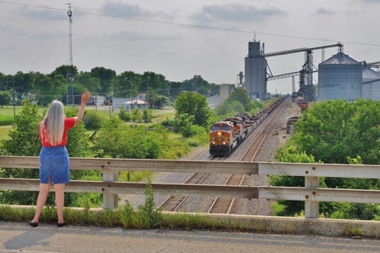 Summer is time for slowing down—even for government and industry.  Why not use the time to catch your wave on HCS/GHS compliance?  (BNSF 4895 East @ Ransom, IL, image © 7/2015 by Nikki Burgess; used with permission.)