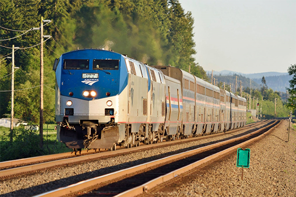 The Federal Railroad Administration marked the one anniversary of the fatal Amtrak derailment near Philadelphia by reiterating progress on PTC installation, especially in areas with heavy passenger service. Here Amtrak’s Coast Starlight train heads north towards Seattle along BNSF tracks in Sumner, Washington last week. © 5/2016 by Nikki Burgess; all rights reserved.