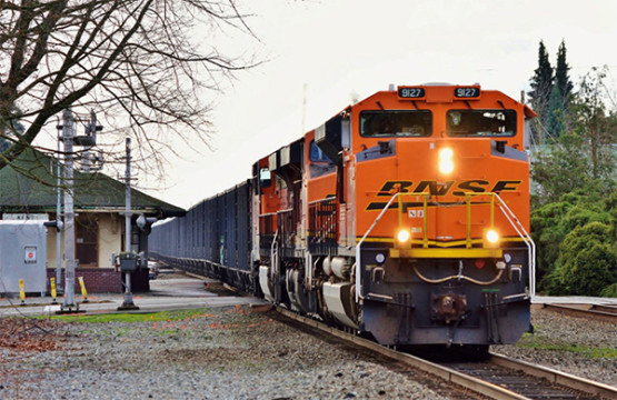 The Federal Railroad Administration (FRA) seeks input on so-called “Quiet Zones” at highway grade crossings to reduce noise without compromising safety. A BNSF train sounds its horns as it crosses a road in Kent, Washington on March 5th, 2016. (© 3/2016) by Nikki Burgess; all rights reserved.) 