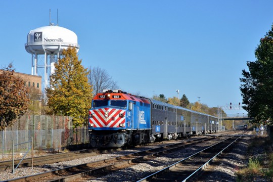 Both BNSF Railway and Union Pacific declare in their correspondence that they will also cease operating both commuter and national rail passenger services, potentially crippling such operations after January 1st.  Here Metra commuter and Amtrak long distance passenger trains approach Naperville, Illinois on the BNSF in October of 2014. (image © 10/2014 by Nikki Burgess; all rights reserved.)
